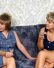 Two drunken mature ladies are doing a youngster